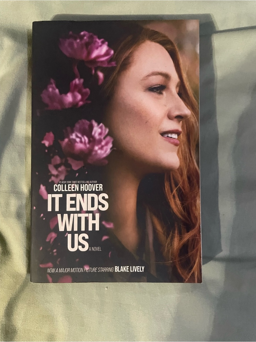 It Ends With Us by Colleen Hoover - Paperback Book with Floral Cover
